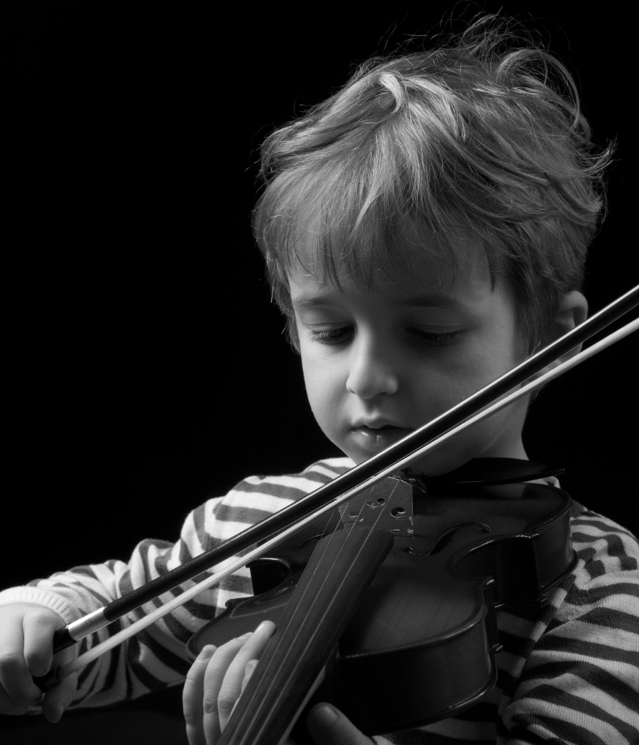 Young child playing violin